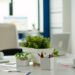 Interior of modern open plan financial office with no people, stylish room interior with meeting table and chairs. Business center with brainstorm area, shot of empty room with modern furniture.